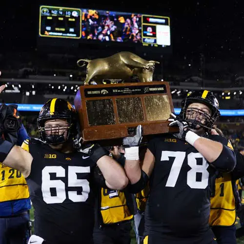 Football players holding trophy